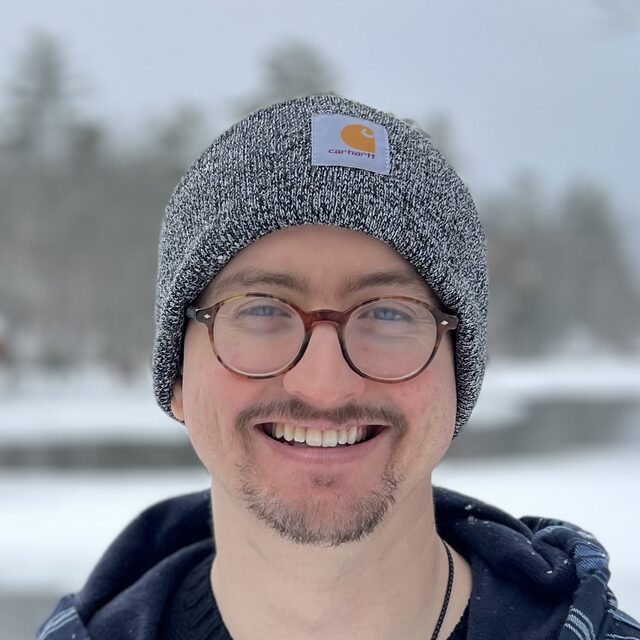 Eric Bauerfeld, outdoors in a knit cap on a snowy day.